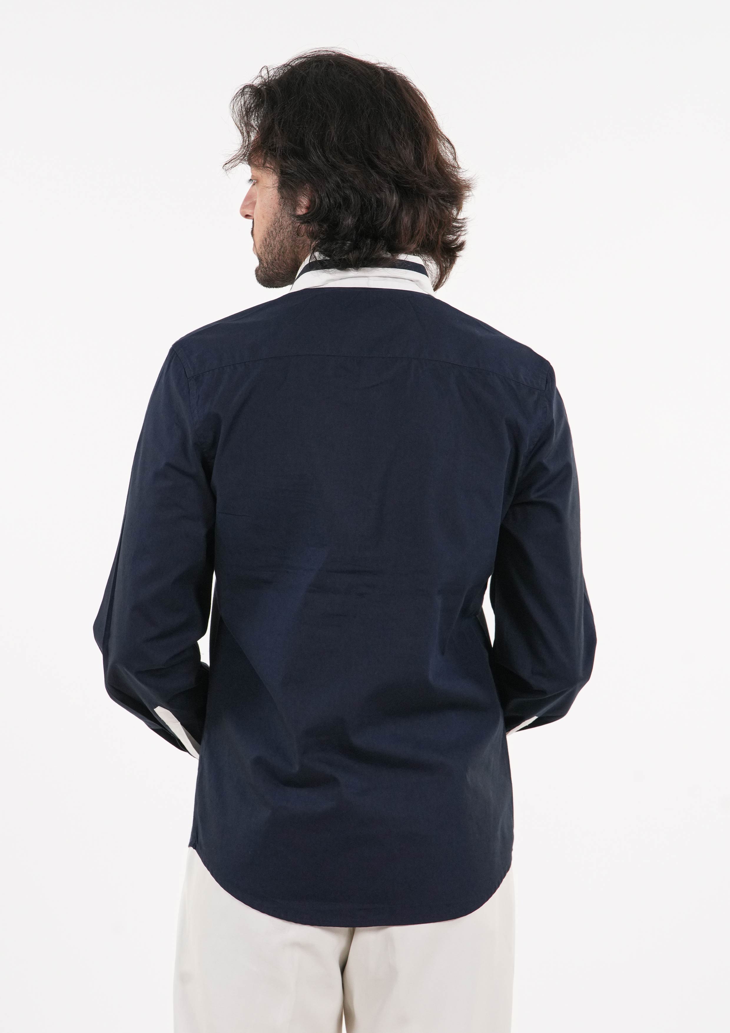 Man wearing a navy blue t shirt on a white background